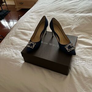 Ron white weren’t dress heels with rhinestone buckle.